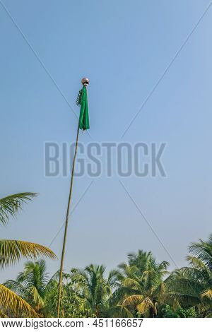 Gudhi Padwa Festival Celebration By Standing The Bamboo Gudhi Flag Of Silk Cloth With Garland And Up