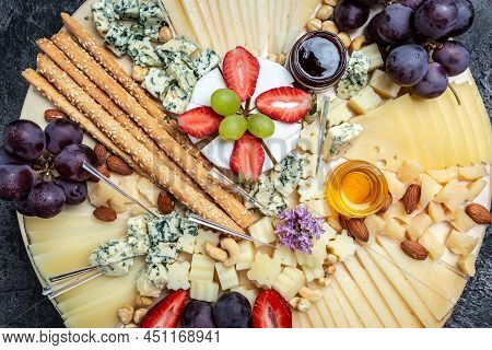 Antipasto Platter, Antipasto Cheese Board Of Various Types Of Soft And Hard Cheese. Spanish Manchego