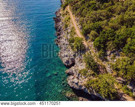 Picturesque Sea Adriatic Coast Of Montenegro. Turquoise Mediteran Sea And Rocky Shore With Evergreen