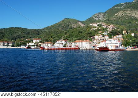 The Ferry Transports Tourists And Cars Across The Bay Of Kotor. Montenegro