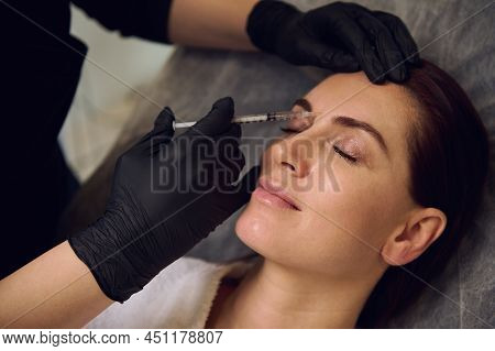 Beautiful Middle Aged European Woman Getting Beauty Injections On Her Face In Wellness Spa Cosmetolo