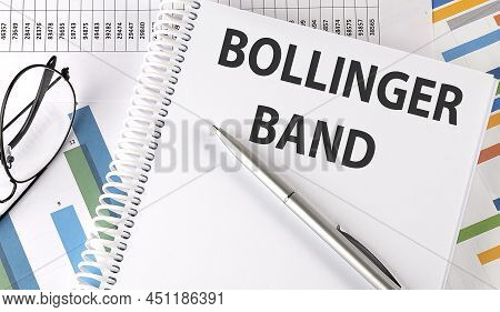 Bollinger Band Text , Pen And Glasses On Chart