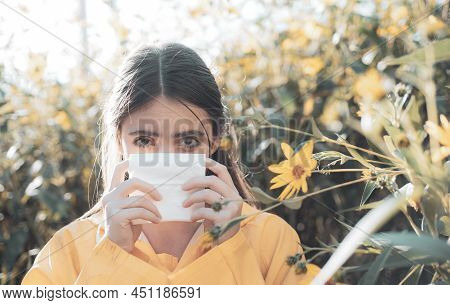 Young Woman Is Going To Sneeze. The Girl Suffers From Pollen Allergy During Flowering And Uses Napki