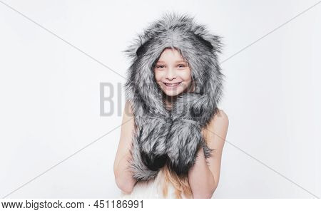Happy Child Smile In Fashion Style. Small Girl Wear Winter Hat Scarf. Small Fashionista. Happy Child