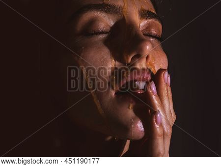 Beautiful Sensual Girl Applying Honey Mask On Face. Portrait Of Girl With A Honey Facialmask Closeup