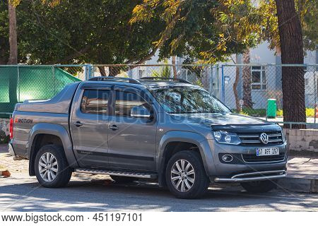 Antalya,  Turkey - March 04 2022:  Gray  Volkswagen Amarok Is Parked  On The Street On A Warm  Day A
