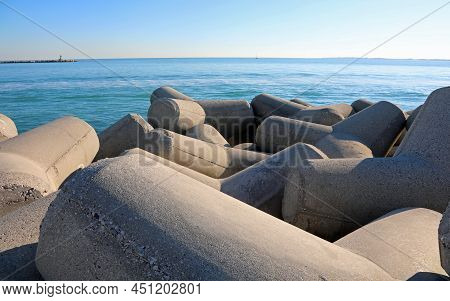 Large Concrete Breakwaters To Protect The Beach From Storm Surges And The Sea