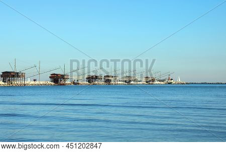 Many Fishing Huts On The Dike And Large Nets For Catching Fish And Crustaceans In The Adriatic Sea I