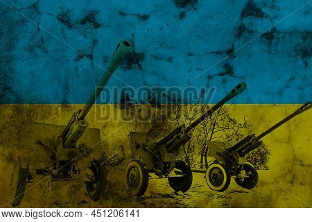 Tanks Lined Up In Front Of The Ukrainian Flag. Several Military Army War Battle Tank Vehicles On The