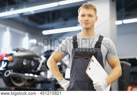 Portrait Of Qualified Maintenance Service Worker In Uniform, Man With Clipboard Paper On Motorbike B