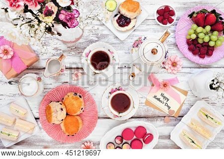 Mother's Day Tea Table Scene Over A White Wood Background. Greeting Card, Gift, Flowers, Vintage Tea