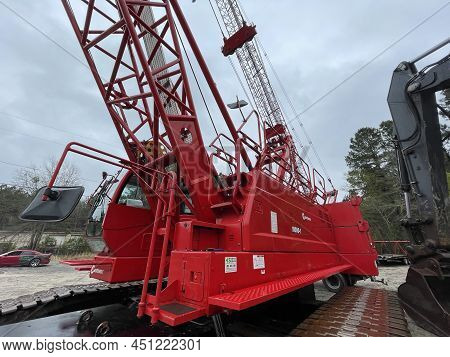 Augusta, Ga Usa - 03 19 22: Manitowoc Red Crane Construction Scene Cloudy Rainy Day Side View Bottom