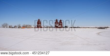 Rowley, Alberta - March 6, 2022: Grain Elevators In The Ghost Town Of Rowley In Winter.