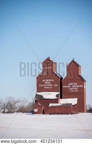 Rowley, Alberta - March 6, 2022: Grain Elevators In The Ghost Town Of Rowley In Winter.
