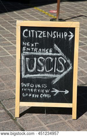 Santa Ana, California - USA - March 13-2022: Citizenship Information chalk board on a sidewalk in Santa Ana California. USCIS Info Pass Interview. Green Card. 