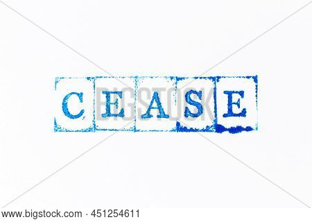 Blue Color Ink Rubber Stamp In Word Cease On White Paper Background