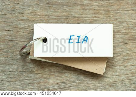Flash Card With Handwriting Word Eia (abbreviation Of Environmental Impact Assessment) On Wood Backg