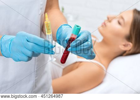 Cosmetologist Does Prp Therapy On The Face Of A Beautiful Woman In A Beauty Salon. Cosmetology Conce