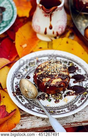 Stuffed Apple Cheesecake On The Table In The Autumn Garden . Selective Focus