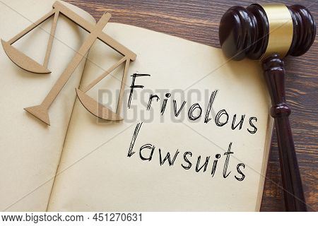 Frivolous Lawsuits Are Shown On A Photo Using The Text