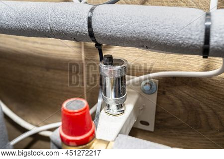 Automatic Air Vent In Expansion Vessel To Protect Against High Pressure In A Modern Boiler Room.