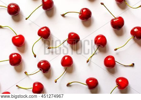 Red Cherries On A Light Background Of Flatley