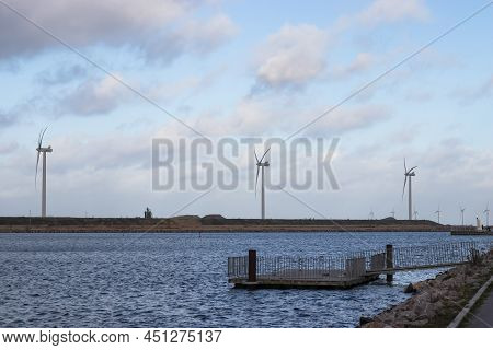 Wind Turbine Farm Power Genarator In Beautiful Nature Landscape For Production Of Renewable Green En