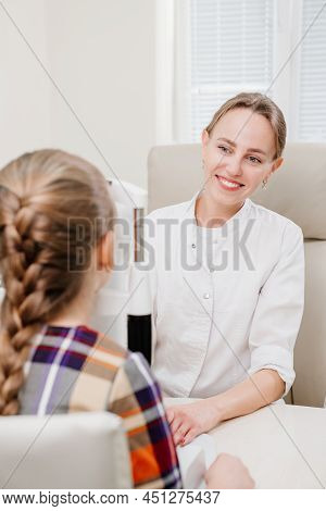 Ophthalmologist Examines The Girl On A Corneo Topographer. Modern Clinic.