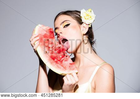 Sexy Young Woman Lick Watermelon With Sexy Tongue Isolated On Gray Background.