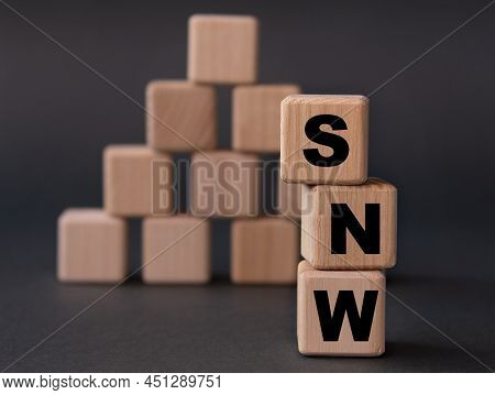 Snw - Acronym On Wooden Cubes On A Dark Background. Internet Concept