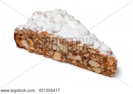 Wedge of fresh traditional Italian Panforte close up isolated on white background 