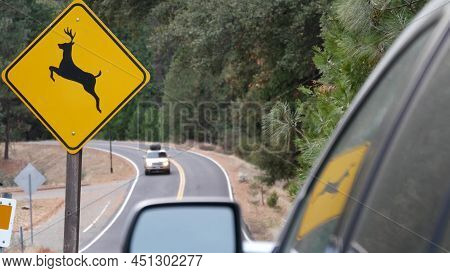 Deer Crossing Warning Yellow Sign, California Usa. Wild Animals Xing Traffic Signage For Safety Driv