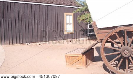 Old Wooden Retro Covered Wagon On Wheels, Wild West Pioneer Ranch. Western Historic Retro Cart, Trad