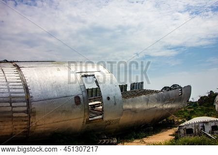 The Wreckage Of The Plane Was Parked On The Open Ground.