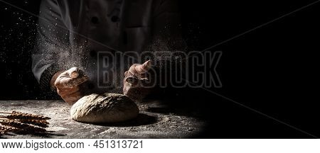 Beautiful And Strong Men's Hands Knead The Dough From Which They Will Then Make Bread, Pasta Or Pizz