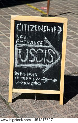 Santa Ana, California - USA - March 13-2022: Citizenship Information chalk board on a sidewalk in Santa Ana California. USCIS Info Pass Interview. Green Card. 
