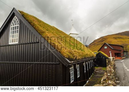 View Of The Kollafjordur Church, Kirkja In Small Village On Streymoy Island. Cloudy Day. Kollafjordu
