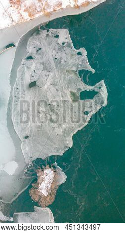 Aerial View Of Ice Seen Separately Covered During Sunrise