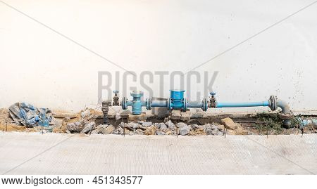 The Plumbing On A Concrete Base. Large Plumbing System Supported In Urban Setting On The Cement Floo