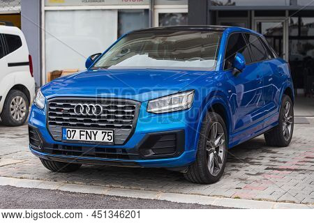 Side; Turkey - March 03 2022:     Blue Audi Q2  Is Parked  On The Street On A Warm  Day