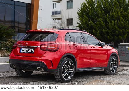 Side; Turkey - March 03 2022:    Red  Mercedes-benz Gla  Is Parked  On The Street On A Warm    Day ,