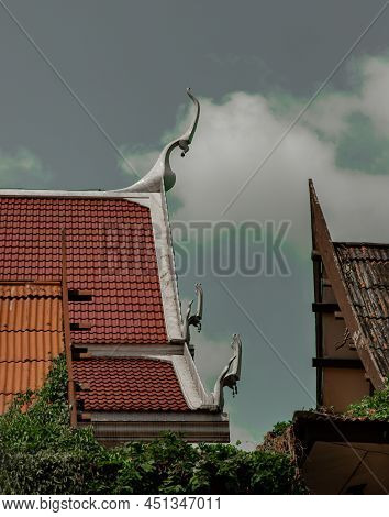 Gable Apex On The Buddhist Temple Roof With Blue Sky Background. Gable Apex At The Top Of Temple Roo