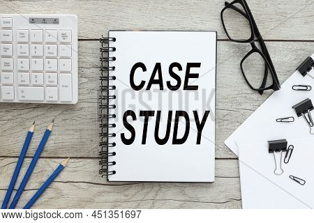 Case Study. Light Working Table And Notepad With Text .