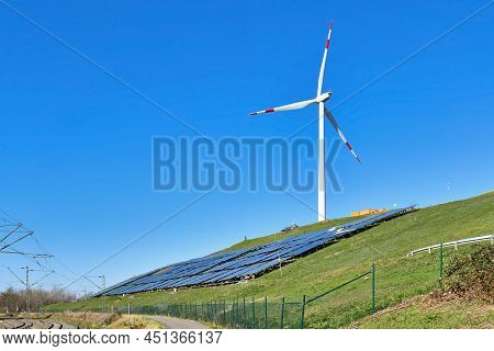 Karlsruhe, Germany - February 2022: Renewable Wind And Solar Energy. Wind Turbine Next To Photovolta
