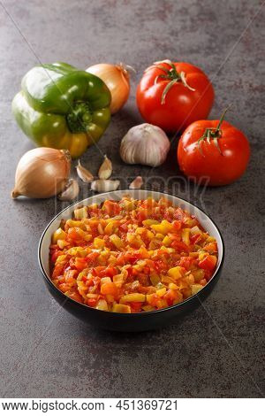 Mediterranean Sofrito Sauce From Ripe Peppers, Tomatoes, Garlic And Onions Close-up In A Plate On Th