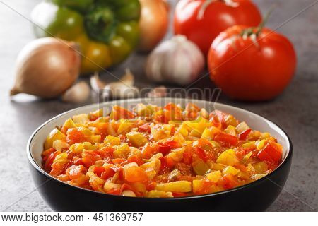 Homemade Sofrito Sauce From Peppers, Tomatoes, Garlic And Onions Close-up In A Plate On The Table. H