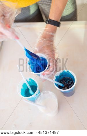 Epoxy Resin Different Blue Color In Cup For Casting Stabilizing Wood, Abstract Art. Process Of Makin