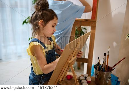 Art Class. Adorable Caucasian Childrenpainting On Canvas. Beautiful Girl In Yellow T-shirt Enjoying 