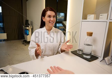 Beautiful Caucasian Middle Aged Woman In White Terry Bathrobe At Medical Appointment In Cosmetologic