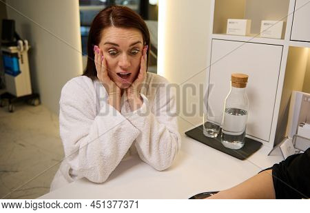 Beautiful European Middle Aged Woman In White Terry Bathrobe At Medical Appointment In Cosmetologica